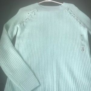 An aqua colored sweater